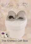 Knitted Gift Box home decor knitting pattern. Knitted white round box with a grey bow on top, approximately 13cm high and 11cm wide.