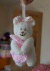 small bear pram charm knitting pattern in cream and pink