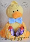 Ducky Egg knitting pattern. Yellow knitted toy duck approximately 18cm tall, designed to hold 2 chocolate eggs in his wings, featuring an orange beak and feet, and a blue bow tie.