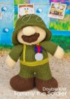 Tommy the Soldier knitting pattern. World War I-themed knitted toy soldier approximately 22cm tall, featuring a dark green uniform, tin hat, and service medal.