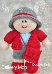 Postman knitting pattern. Cream-colored knitted toy doll approximately 30cm tall, featuring a red uniform, blue hat, and grey bag, inspired by the Royal Mail.