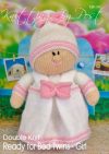 Ready for Bed Twin Girl knitting pattern. Cream-colored knitted toy doll approximately 28cm tall, dressed in a pink nightie and hat, embodying a bedtime theme.