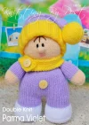 Parma Violet knitting pattern. Lavender-themed knitted toy doll approximately 26cm tall, featuring a lilac dress, cream accents, and a yellow hat with a pom-pom.