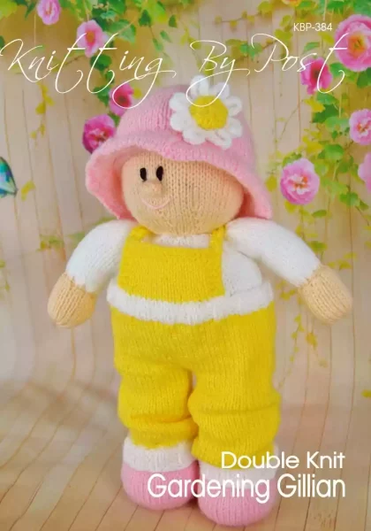 Gillian Gardening Girl knitting pattern. Cream-colored knitted toy doll approximately 32cm tall, dressed in yellow dungarees and a pink hat, embodying a gardening theme.