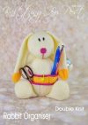 Rabbit Organiser knitting pattern. Cream-colored knitted toy rabbit approximately 30cm tall, featuring 10 pockets for holding small items, making it a functional desk organizer or gift for teachers.