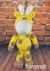 A safari giraffe soft toy pattern with yellow body cream horns and brown spots made from the giraffe toy knitting pattern