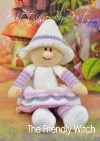 Halloween Friendly Witch toy knitting pattern. Knitted witch wearing a white dress with pink and lilac accents, a white hat, and pink shoes, approximately 45cm tall when standing.