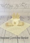 Reindeer Comforter toy knitting pattern. Knitted cream square blanket with an attached beige reindeer head featuring antlers,