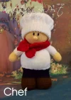 Chef knitting pattern. Cream-colored knitted toy doll approximately 27cm tall, featuring a white chef's hat, red neckerchief, and black shoes, embodying a culinary theme.
