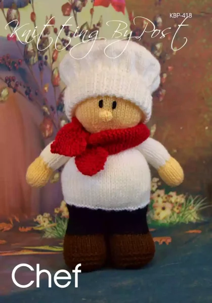 Chef knitting pattern. Cream-colored knitted toy doll approximately 27cm tall, featuring a white chef's hat, red neckerchief, and black shoes, embodying a culinary theme.