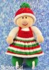 Skater Girl knitting pattern. Winter-themed knitted toy doll approximately 28cm tall, featuring a white outfit with red accents and ice skates, ready for the skating season.