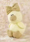 Duckling knitting pattern. Cream-colored knitted toy duckling approximately 22cm tall, featuring a brown beak and feet.