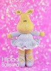 Hippo Ballerina knitting pattern. Brown knitted hippopotamus wearing a lilac tutu and ballet slippers, standing on tiptoes