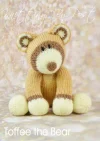 Toffee the Bear knitting pattern – light brown knitted teddy bear with cream-colored snout, inner ears, and paw pads, featuring dark brown nose and embroidered eyes, knitted with double knitting yarn.