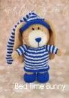 Bed Time Bunny Rabbit knitting pattern. Brown and cream-colored knitted toy rabbit approximately 22cm tall, wearing blue pajamas and a matching nightcap, perfect for bedtime cuddles.