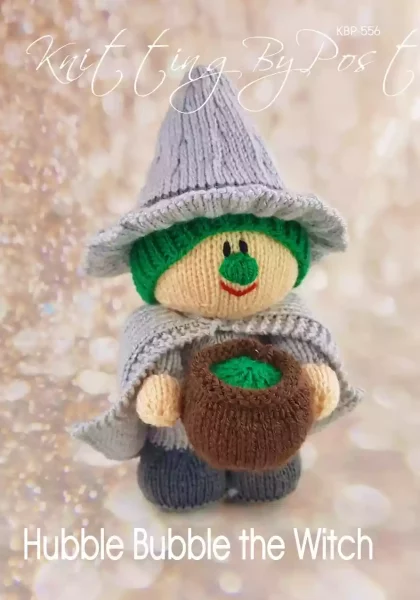 Hubble Bubble the Witch knitting pattern. Halloween-themed knitted toy witch approximately 27cm tall, featuring a light grey dress, dark grey pointed hat, green face, and holding a brown cauldron