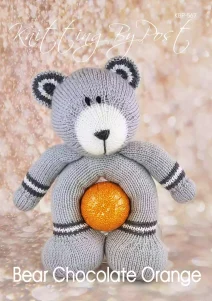 Chocolate Orange Bear knitting pattern. Light grey knitted toy bear approximately 27cm tall, featuring dark grey ears, white snout, and a hollow body designed to hold a chocolate orange.