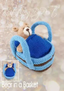 Bear in a Basket knitting pattern. Cream-colored knitted toy bear approximately 12cm tall, nestled in a light blue basket measuring approximately 18cm long and 11cm wide.