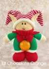 Chocolate Orange Elf knitting pattern. Christmas-themed knitted toy elf, designed to hold a chocolate orange within its body. Features a green outfit with red accents and a festive hat
