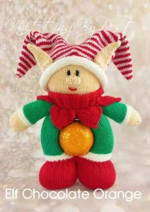 Chocolate Orange Elf knitting pattern. Christmas-themed knitted toy elf, designed to hold a chocolate orange within its body. Features a green outfit with red accents and a festive hat