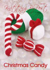 Christmas Candy knitting pattern. Christmas-themed knitted decorations including a candy cane (approximately 20cm tall), a sweetie (approximately 12cm wide), and a gift box (approximately 10cm tall), all featuring festive red and white colors.