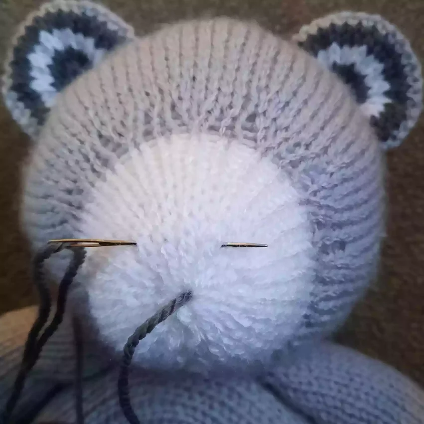 How to sew a nose to a knitted toy - step 3