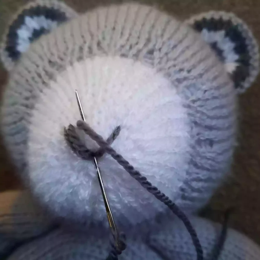 How to sew a nose to a knitted toy - step 5