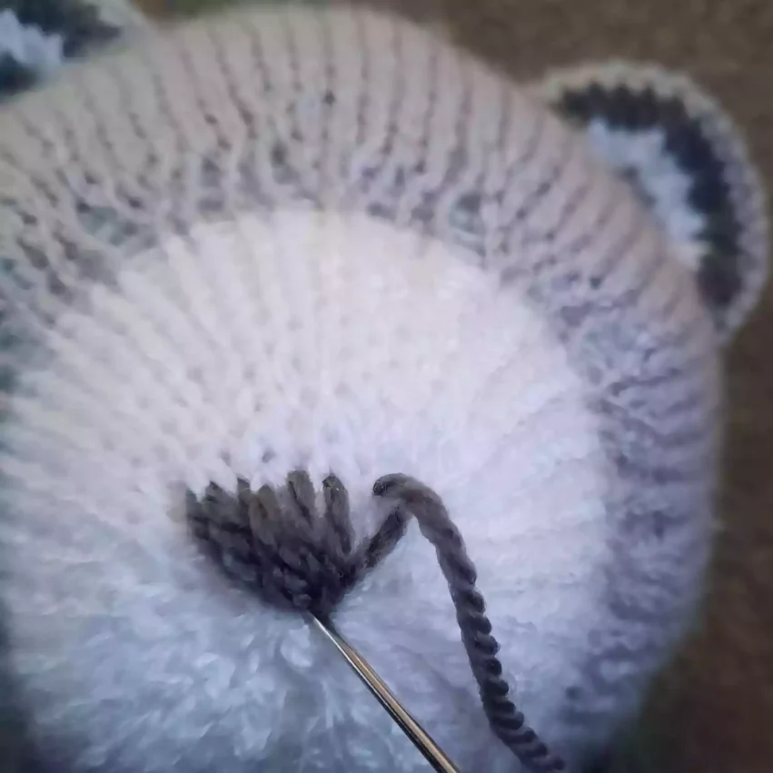 How to sew a nose to a knitted toy - step 6