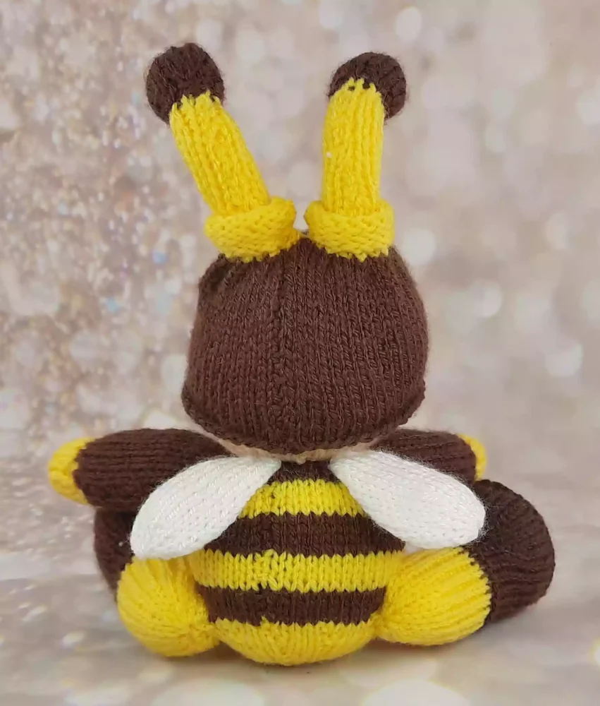 back of knitted bee soft toy