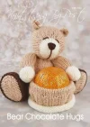 Hand-knitted brown bear holding a chocolate treat, made using the Bear Chocolate Hugs knitting pattern.