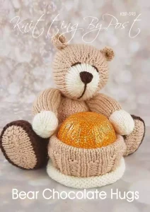 Hand-knitted brown bear holding a chocolate treat, made using the Bear Chocolate Hugs knitting pattern.