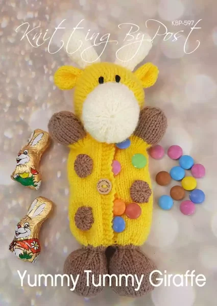 Knitted yellow giraffe toy with brown spots. made from the Yummy Tummy Giraffe knitting pattern, featuring a tummy pocket for storing Easter treats