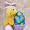 Toy knitting pattern for a yellow duck with orange wings and beak made from the Duck Chocolate Hugs Easter Egg knitting pattern