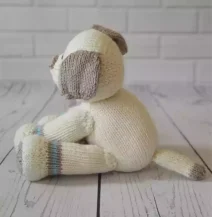 cute knitted dog side view